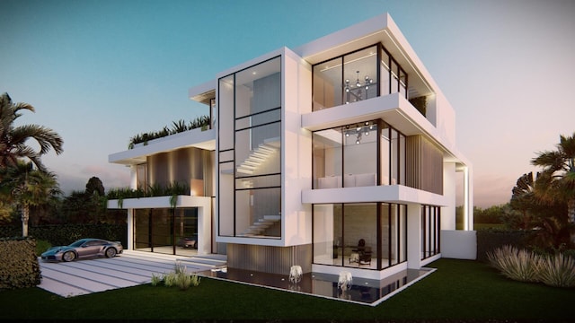 rear view of property with a balcony