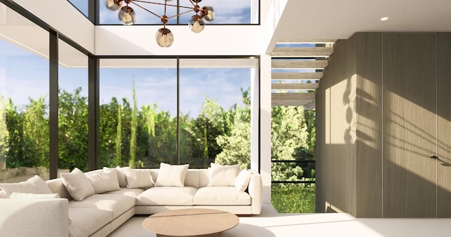 sunroom / solarium with an inviting chandelier