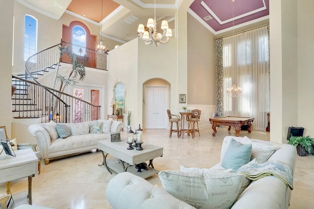 living room featuring light tile patterned flooring, coffered ceiling, a high ceiling, and a chandelier