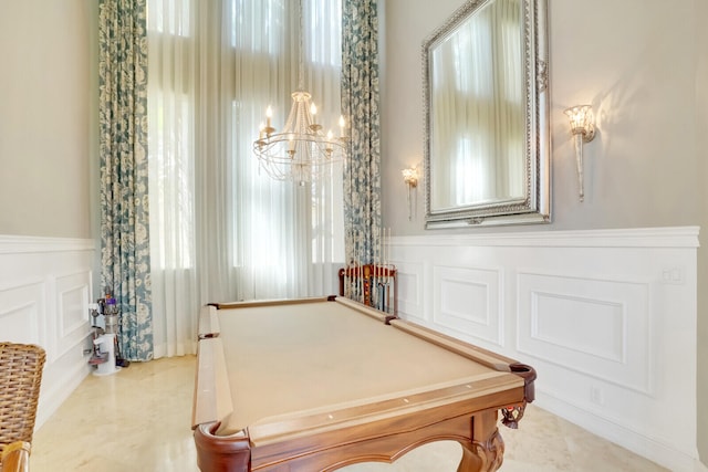 game room with light tile patterned floors, pool table, and an inviting chandelier