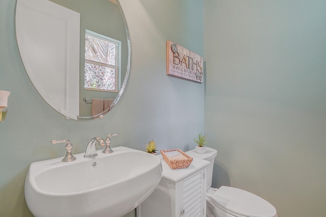 bathroom with sink and toilet