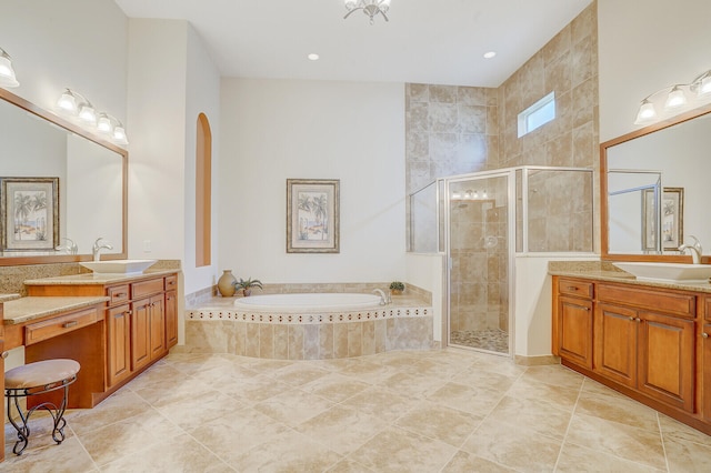 bathroom featuring separate shower and tub, vanity, and tile patterned floors