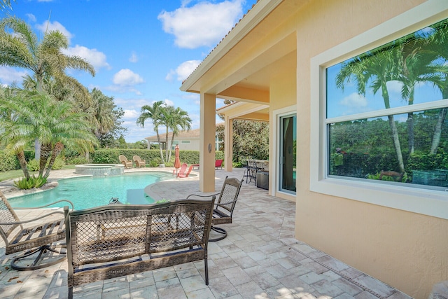 view of patio with a swimming pool with hot tub