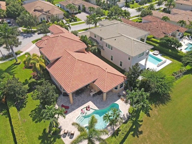 birds eye view of property with a residential view