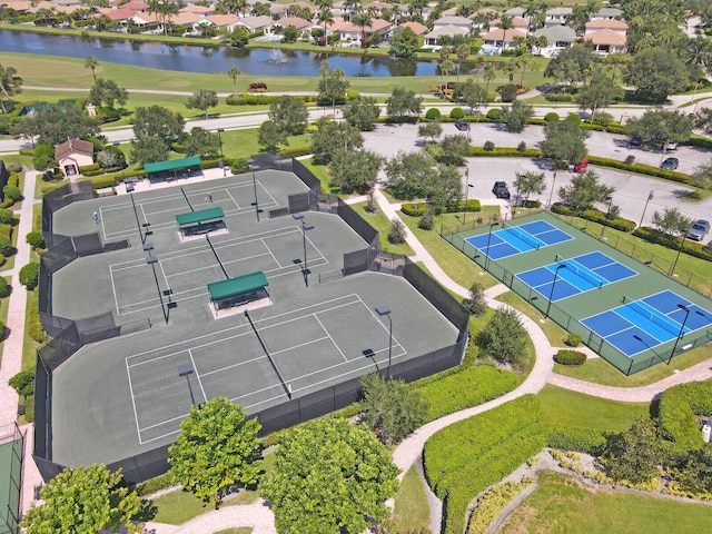 birds eye view of property with a residential view and a water view