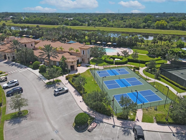 birds eye view of property with a water view