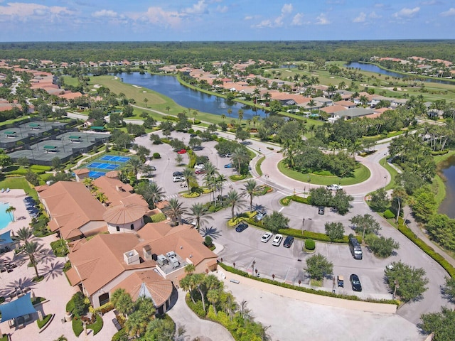 birds eye view of property featuring a water view and a residential view