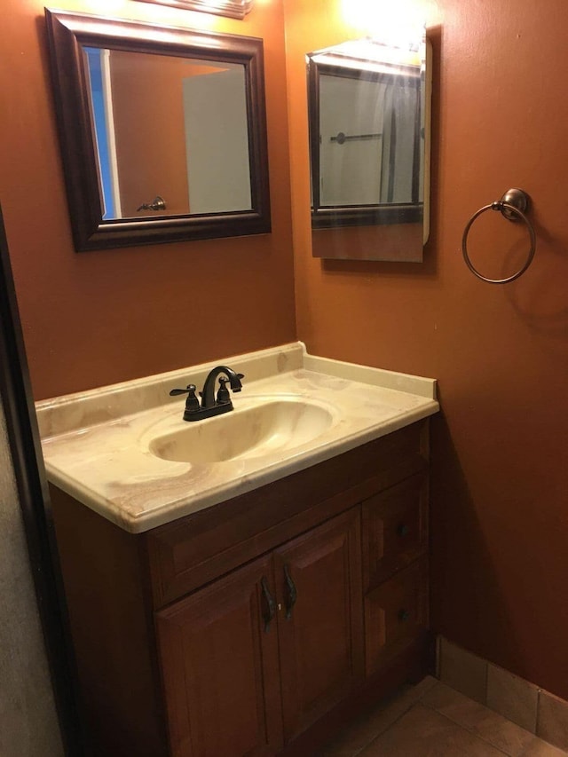 bathroom with tile patterned flooring and vanity