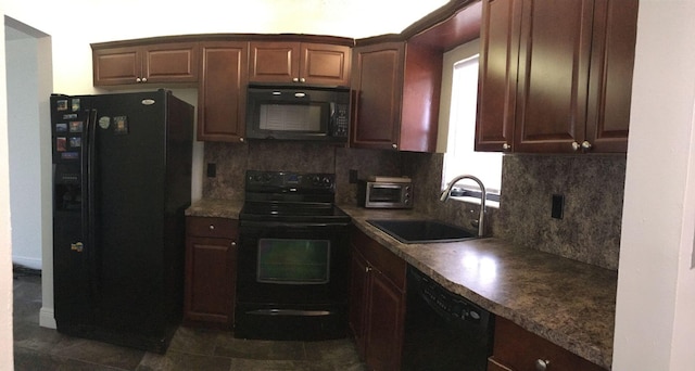 kitchen with dark tile patterned flooring, backsplash, sink, and black appliances