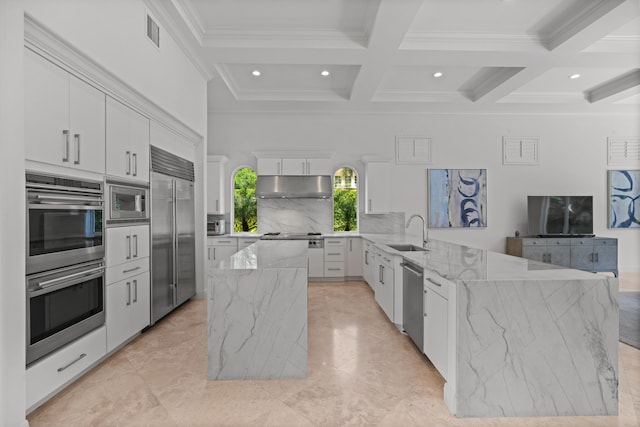 kitchen featuring sink, light tile patterned flooring, and built in appliances