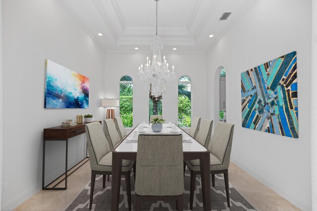 dining area featuring a tray ceiling, light tile patterned flooring, and a chandelier