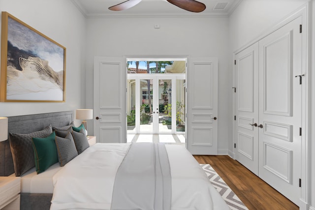 bedroom with ceiling fan, a closet, french doors, and dark hardwood / wood-style flooring