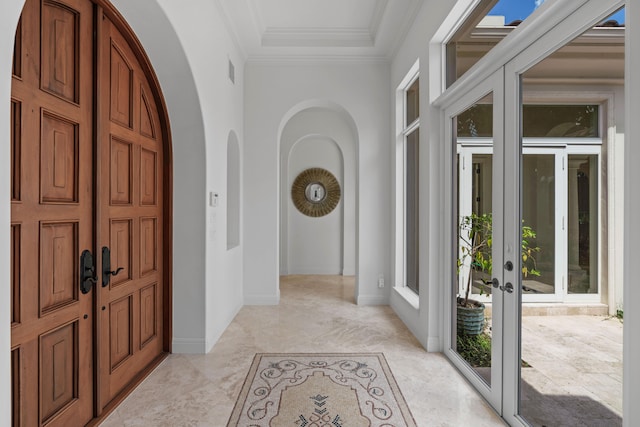 tiled foyer entrance featuring plenty of natural light and french doors