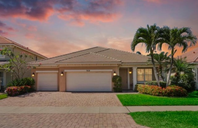 mediterranean / spanish house featuring a garage