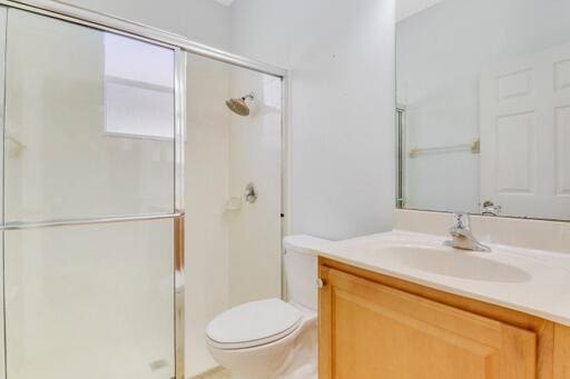 washroom with sink, cabinets, light tile patterned floors, and washing machine and clothes dryer