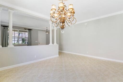 spare room featuring a notable chandelier and ornamental molding