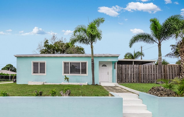 view of front of home with a front yard