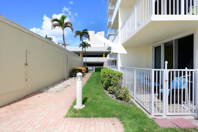 view of yard featuring a balcony