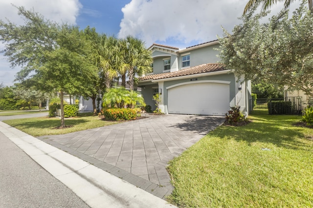 mediterranean / spanish house with a front lawn