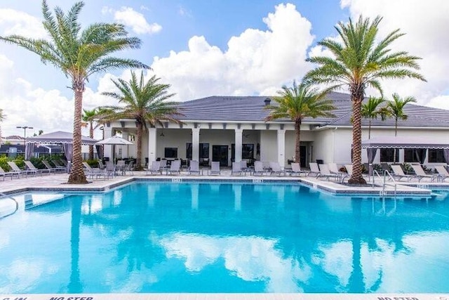 view of swimming pool with a patio area