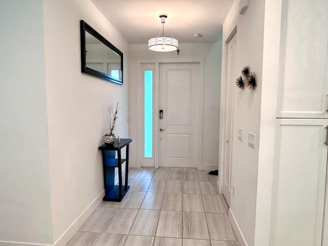 entrance foyer featuring light tile patterned flooring