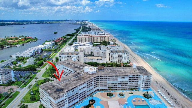 aerial view featuring a view of the beach and a water view