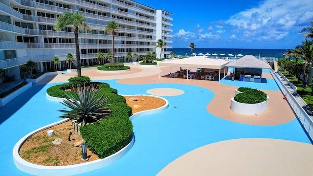 view of pool featuring a gazebo and a water view