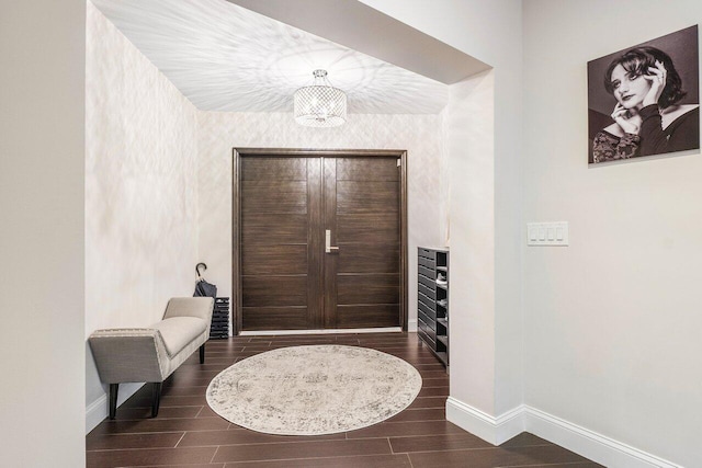 entryway featuring wood finish floors and baseboards