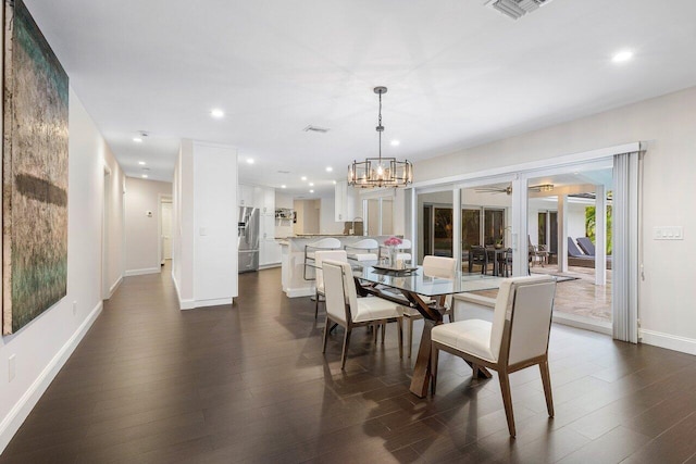 dining room with dark wood-style floors, baseboards, visible vents, and recessed lighting