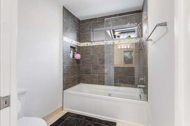 full bath featuring baseboards, toilet, and shower / bathtub combination