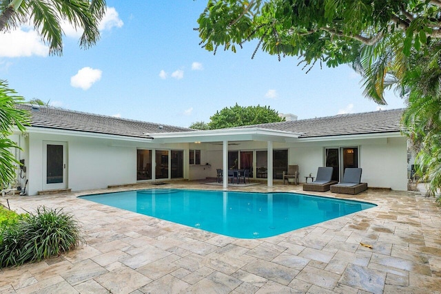 pool with a patio