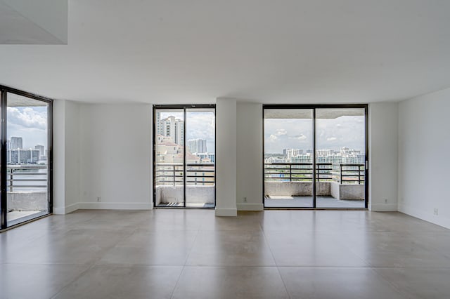 unfurnished room with a wealth of natural light and floor to ceiling windows