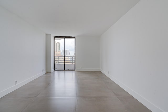 spare room featuring floor to ceiling windows