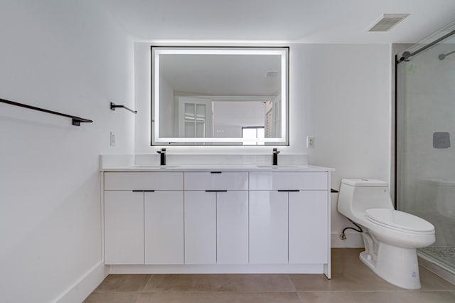 bathroom featuring vanity, tile patterned flooring, toilet, and walk in shower