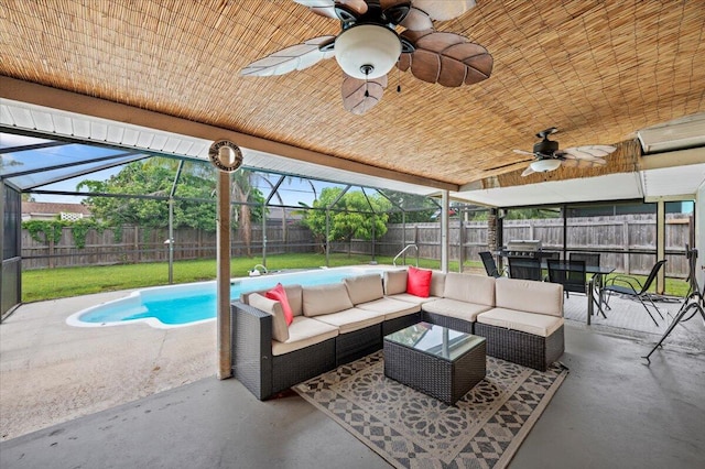 view of patio with a fenced in pool, an outdoor living space, a lanai, and ceiling fan