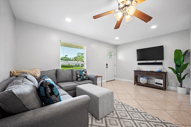 living room with light tile patterned floors and ceiling fan