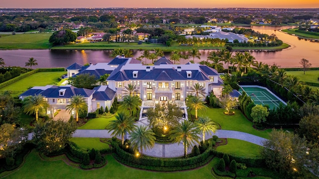 aerial view at dusk with a water view