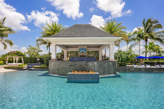 view of swimming pool featuring a gazebo and pool water feature