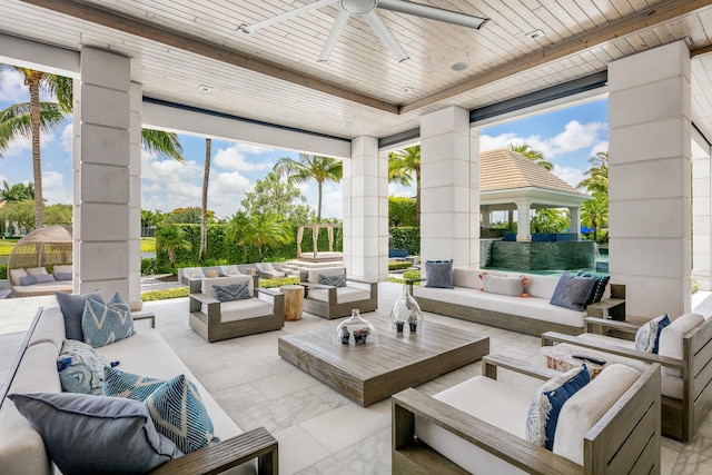 view of patio with an outdoor living space and ceiling fan