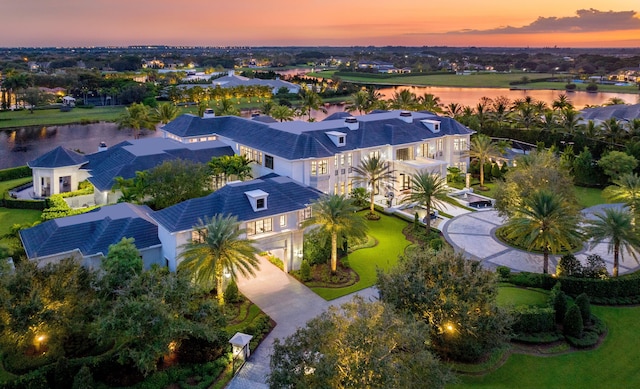 aerial view at dusk with a water view