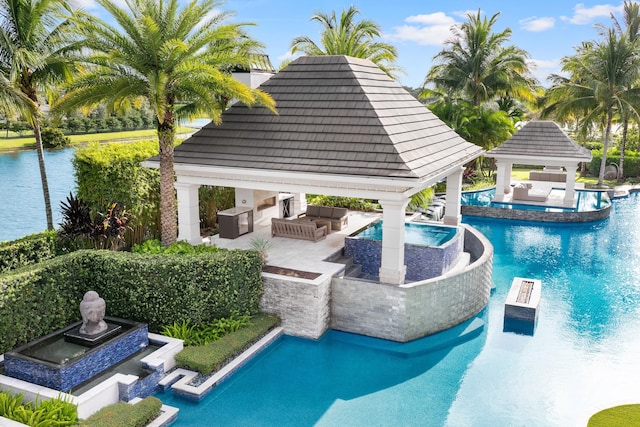 view of pool with a gazebo, outdoor lounge area, and a patio