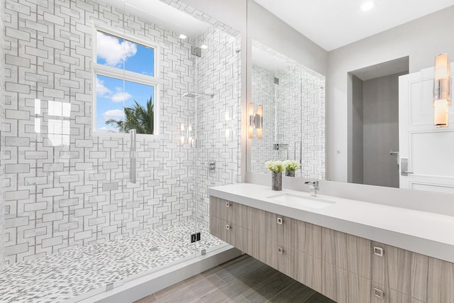 bathroom featuring an enclosed shower and vanity