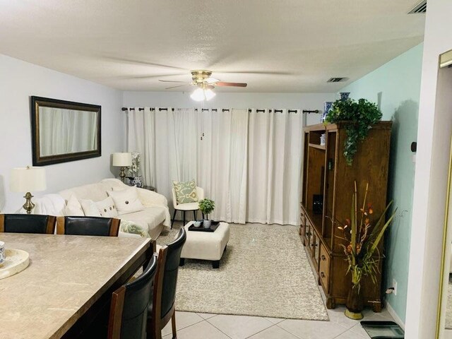 tiled bedroom with ceiling fan