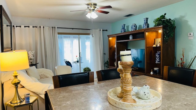 dining room with ceiling fan