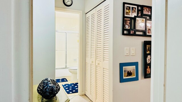 hallway featuring light tile patterned floors