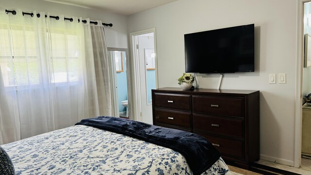 bedroom with connected bathroom