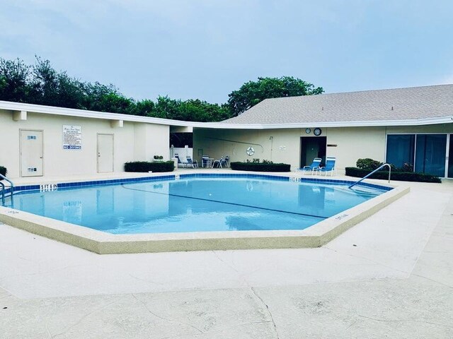 view of pool featuring a patio area