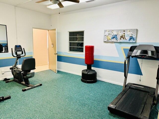 exercise room featuring carpet floors and ceiling fan