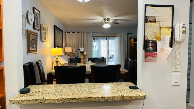 dining room featuring ceiling fan