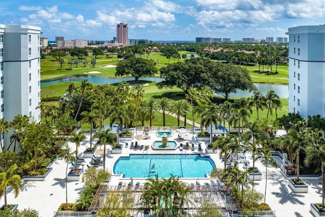 view of swimming pool featuring a water view and a patio area